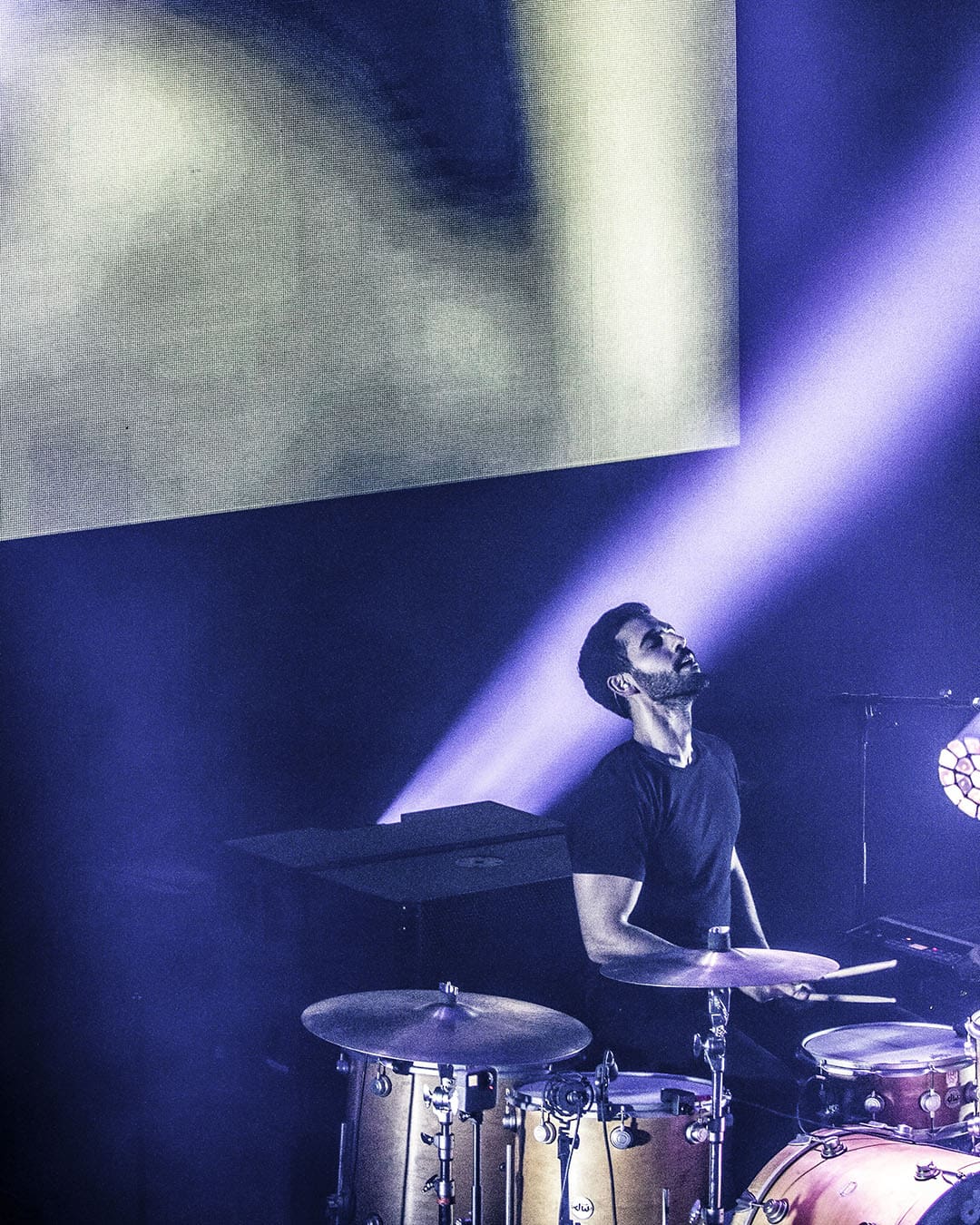 Carl Gerges playing the drums on stage. Photography by Charbel Abou Zeidan