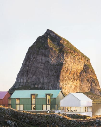 Ytri hotel in front of a mountain in Norway.