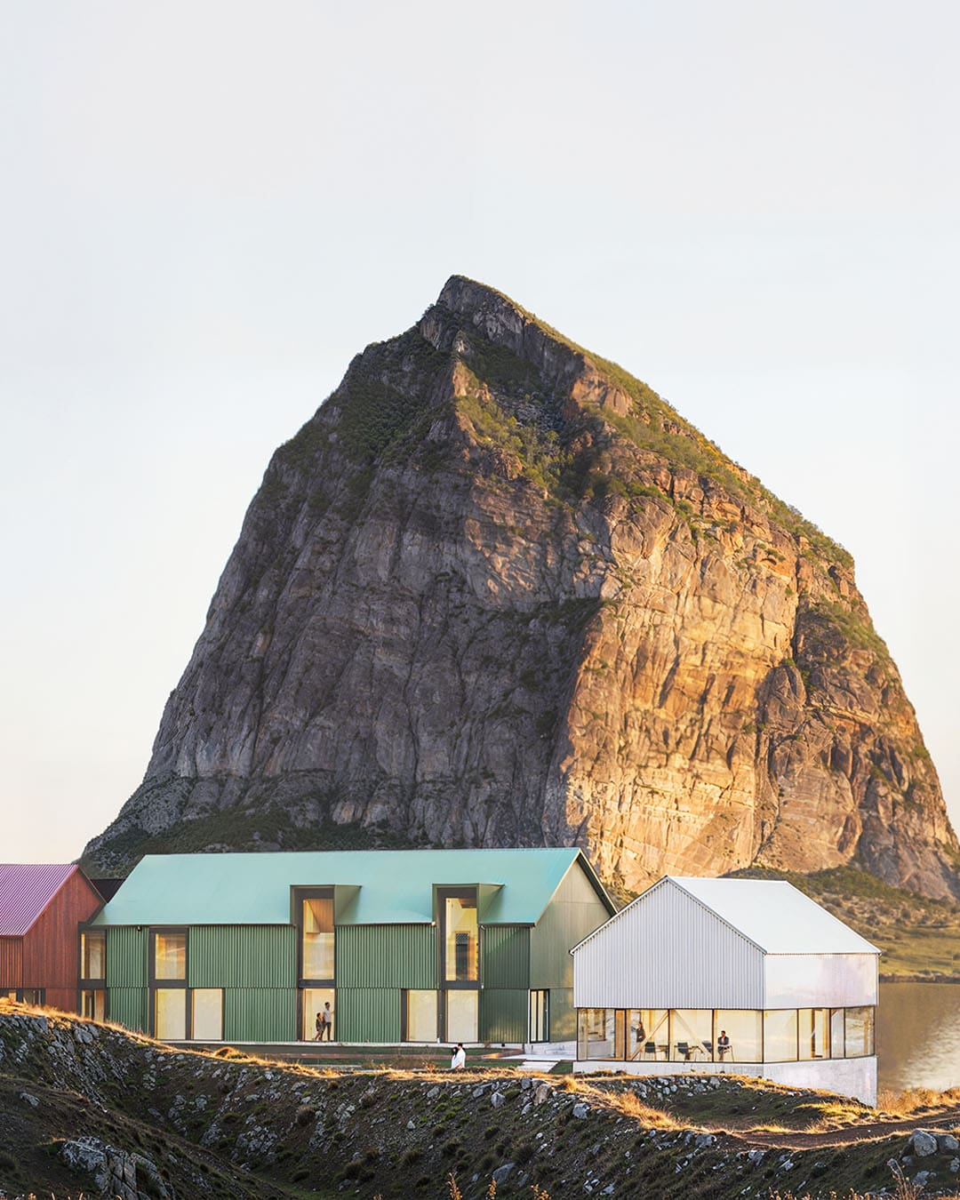 Ytri hotel in front of a mountain in Norway.