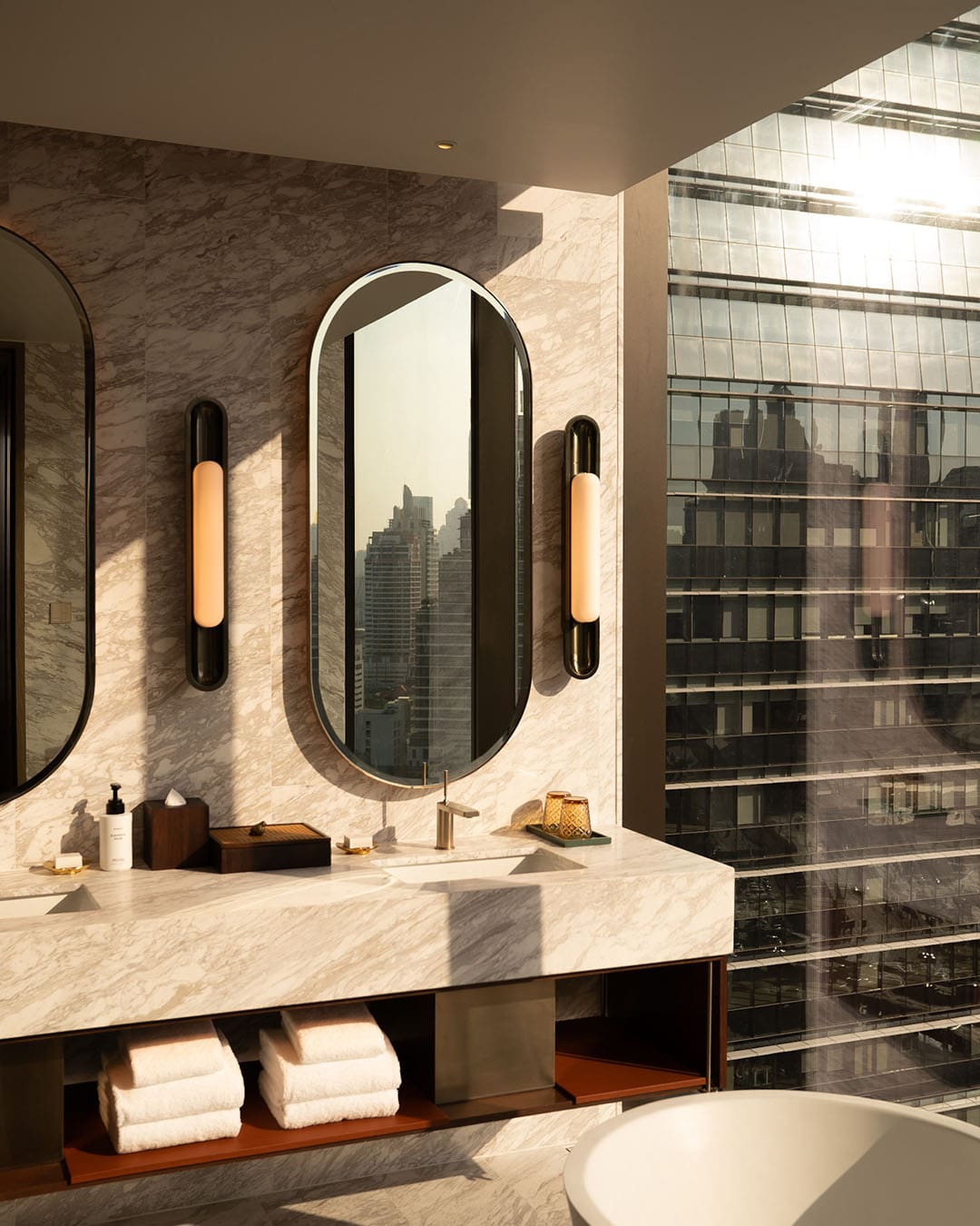 Marble bathroom and city views at Andaz One Bangkok