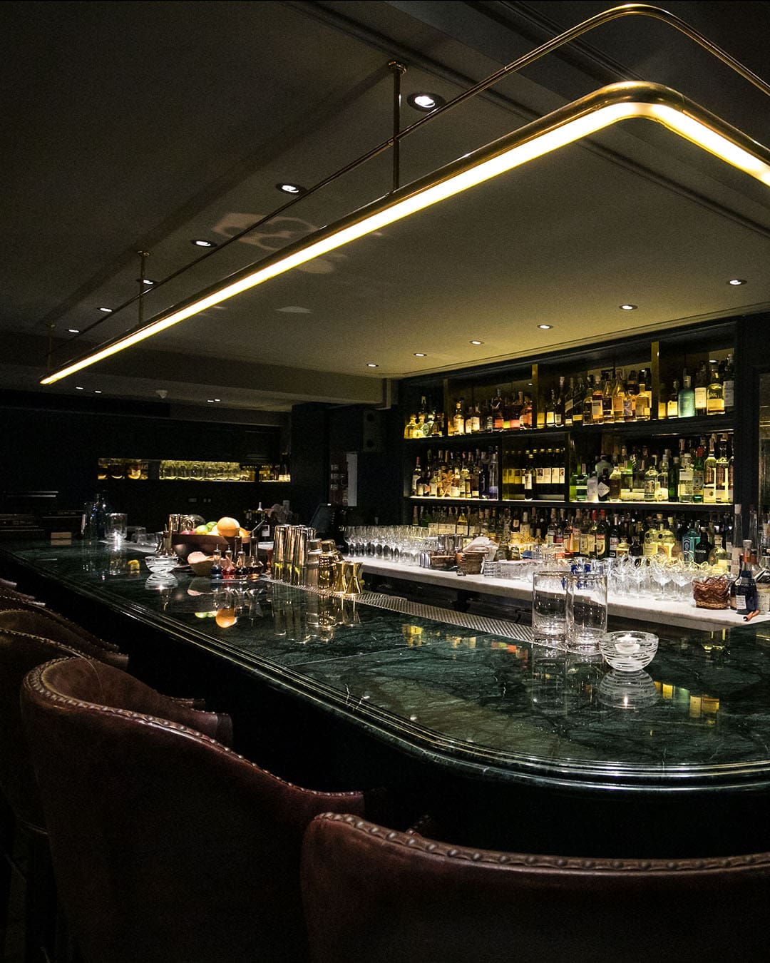 An impressive bar showing off drinks and bottles in Bangkok