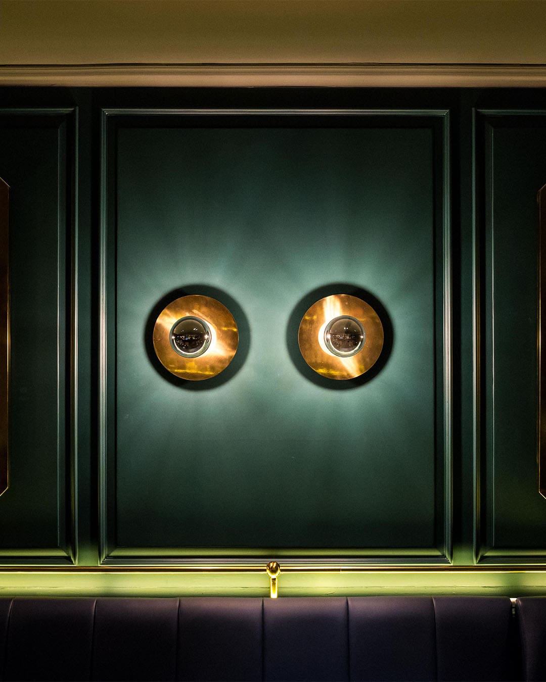 A wall detail glows at Vespers, a bar in Bangkok