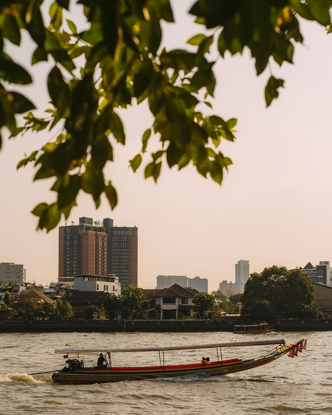 A boat on Chao Phraya River. Photography by Adam Birkan