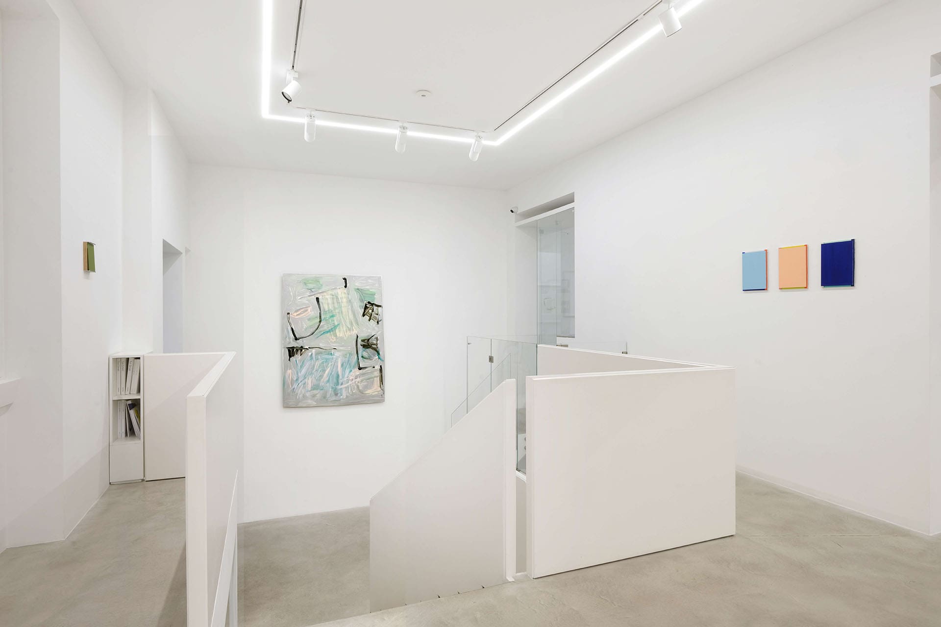 Art in a minimalist white wall setting at Dep Art Gallery in Milan