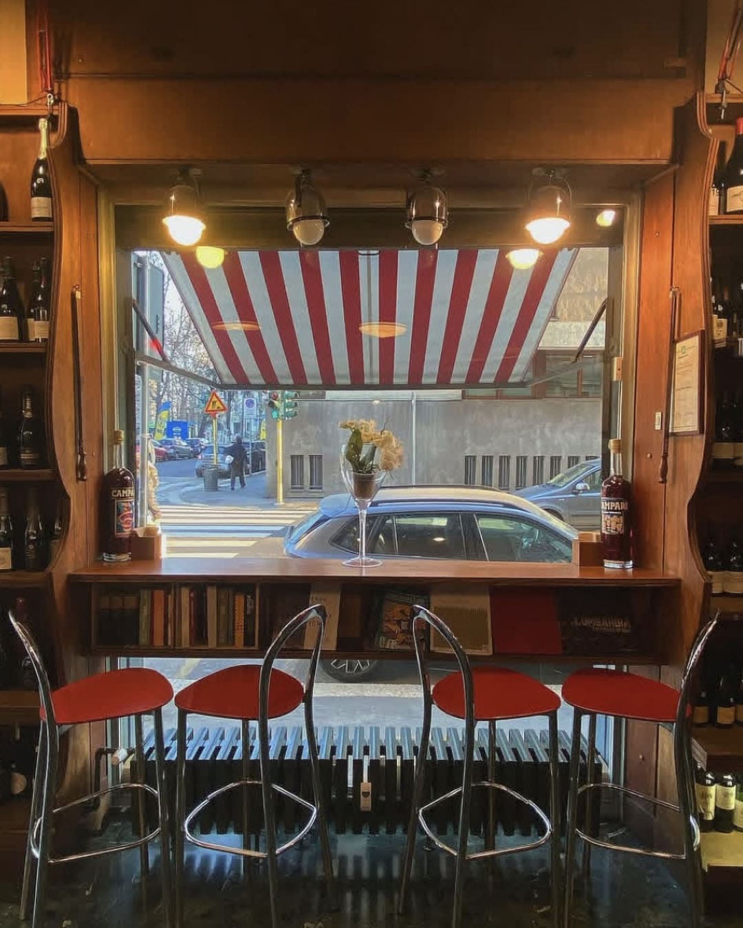 Striped awnings in view at Bottiglieria Bulloni in Milan