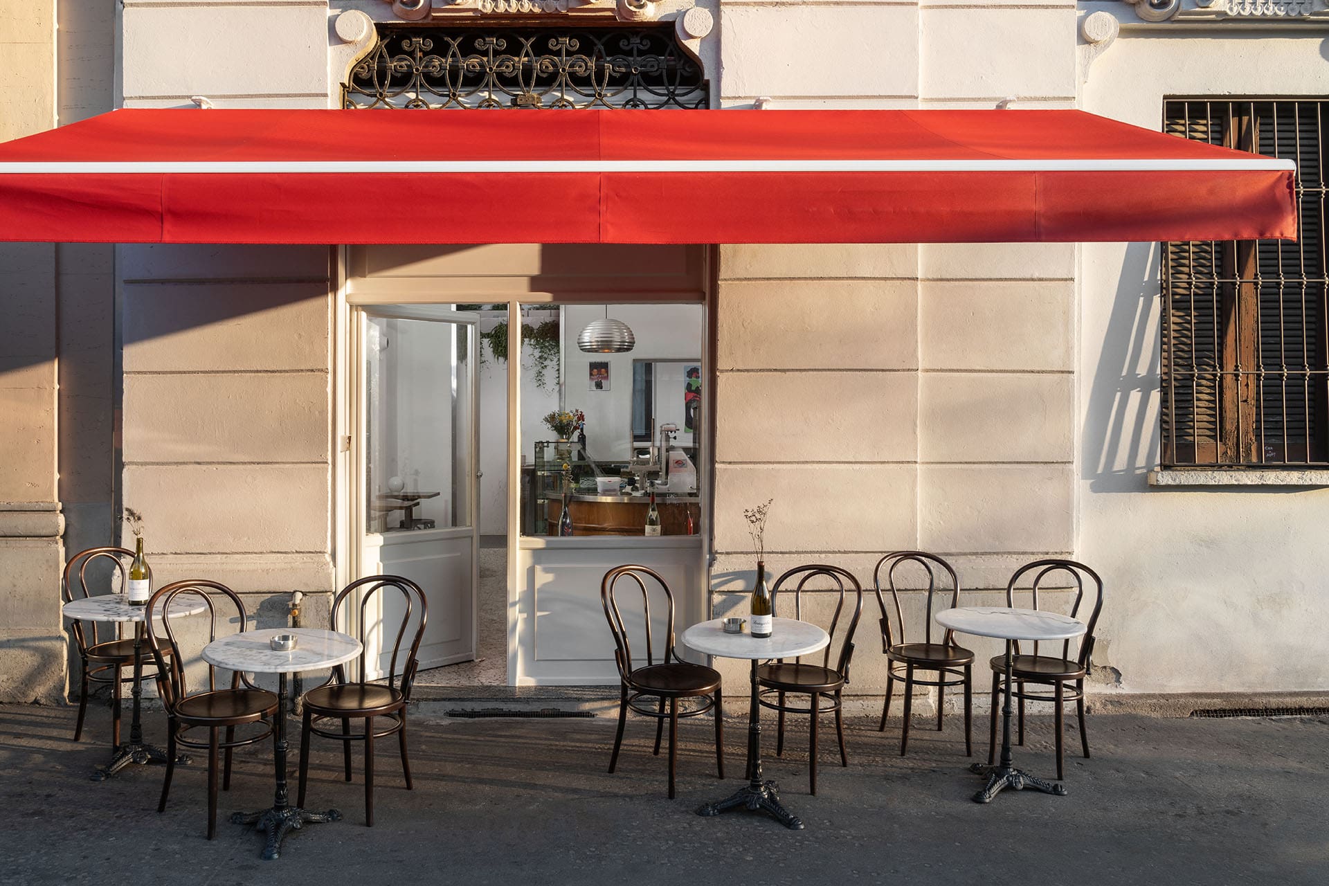 The red awning outside Bar Paradiso in Milan