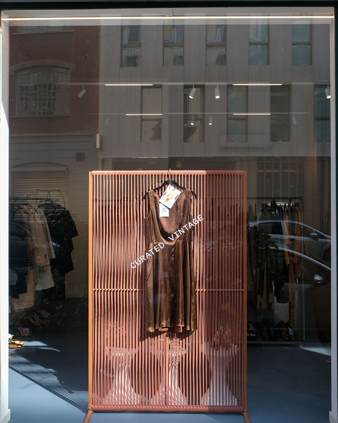A dress displayed in the window of a high end vintage fashion shop, Shop the Story in Milan
