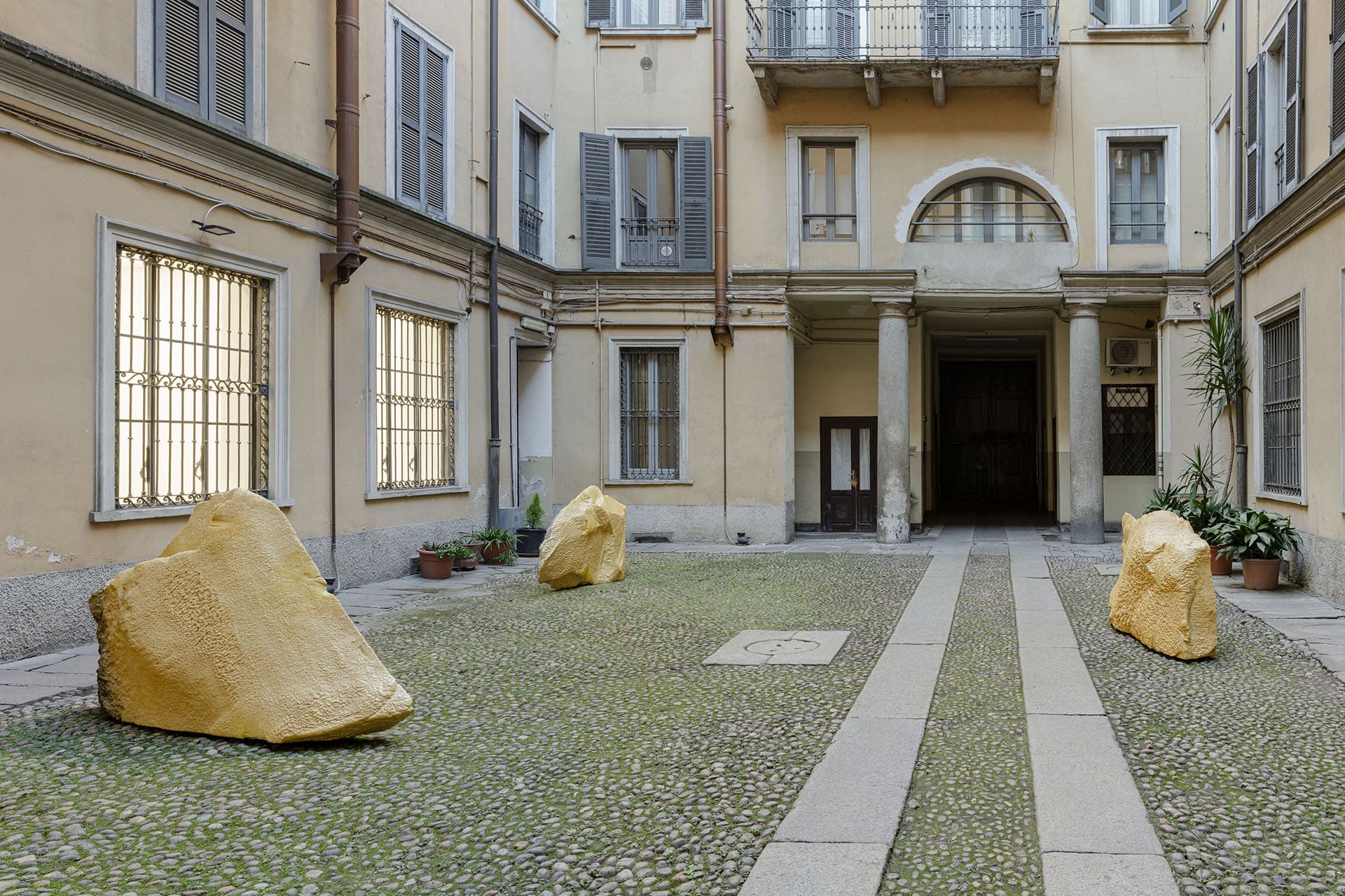 Golden rock installation at Clima Gallery in Milan