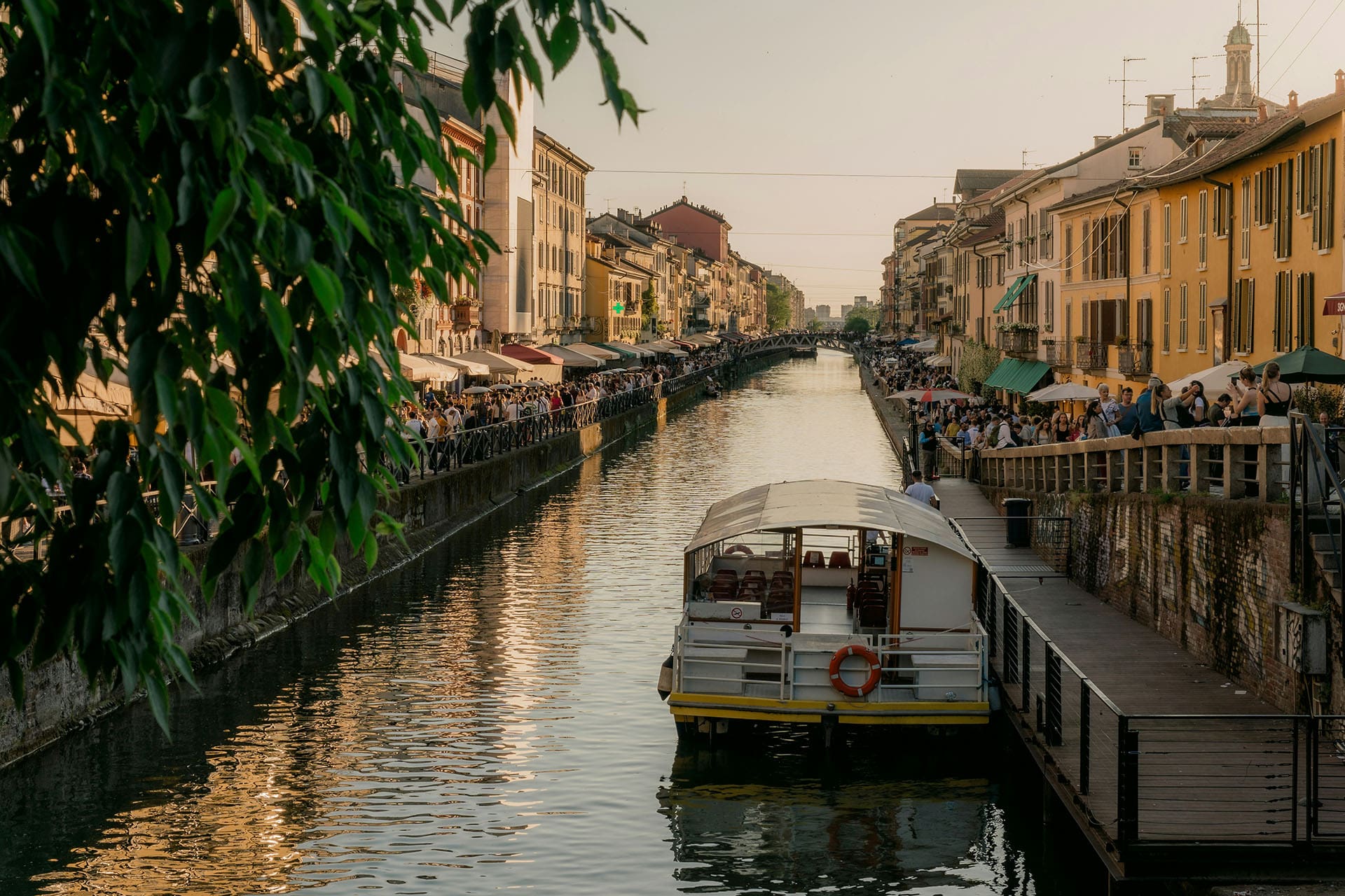 A vintage market on two sides of a canal in MIlan. Taken at sundown
