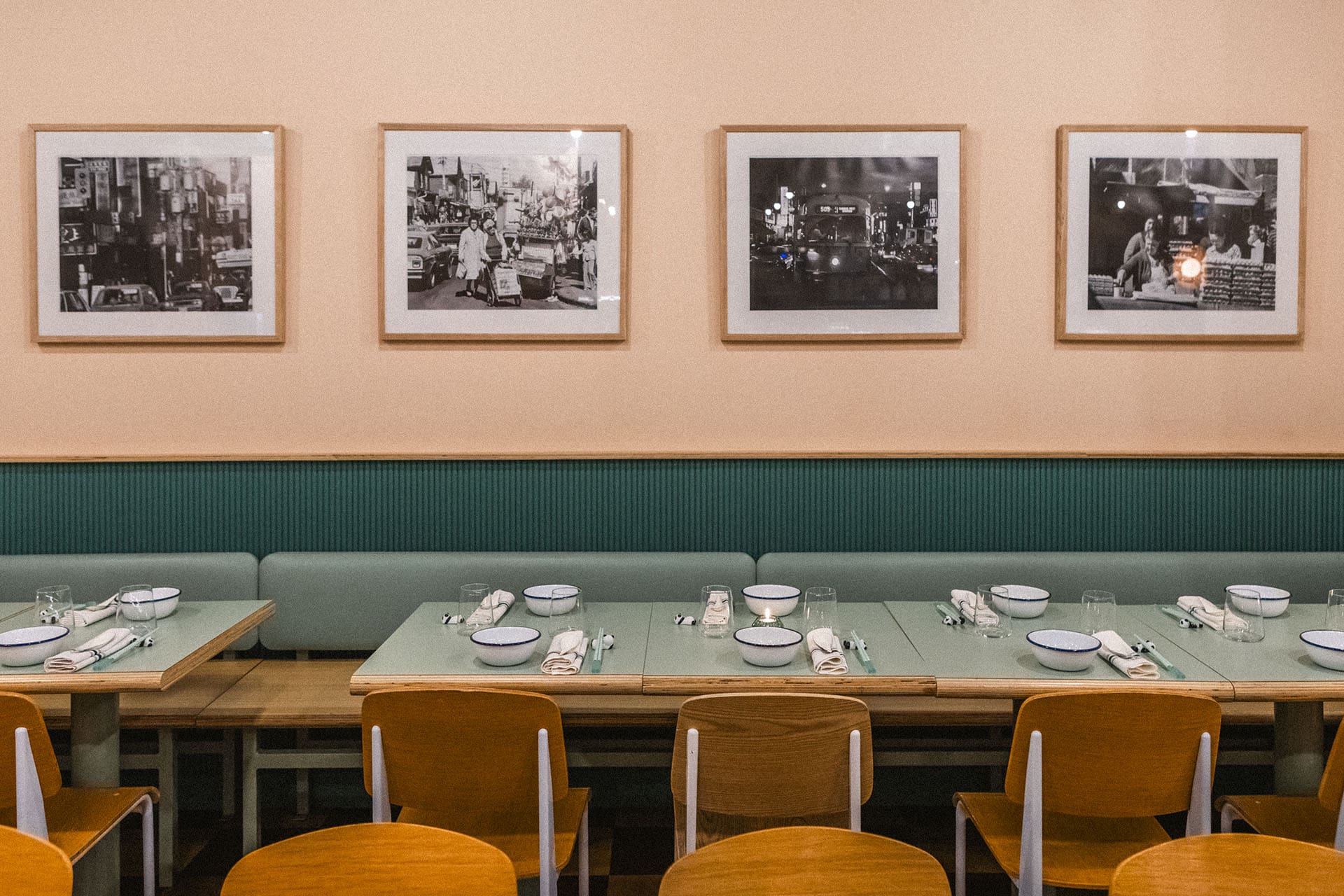 Tables and chairs with vintage photographs on wall