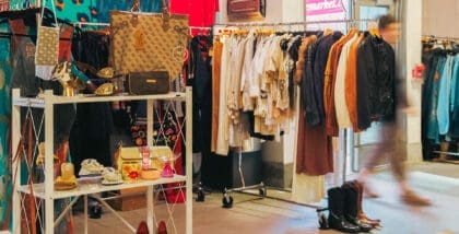 A customer leaves the changing room at Sunday Variety at St.Lawrence Market surrounded by designer vintage bags, shoes and accessories
