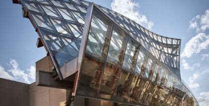 The glass exterior of the Art Gallery of Ontario on show during a sunny day