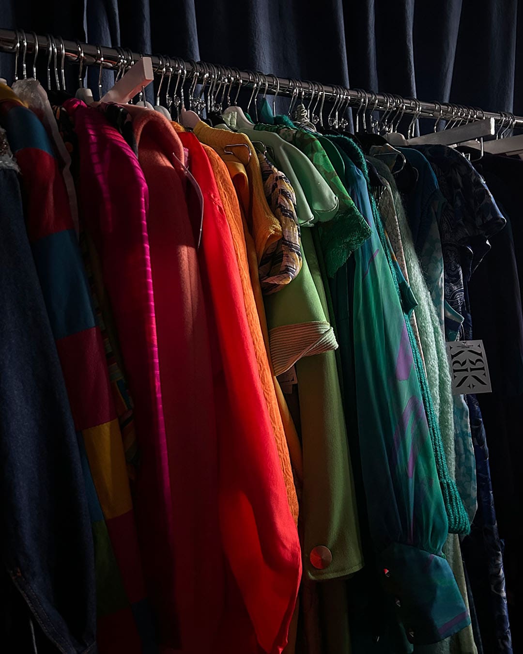 Clothing in a rack at Nouveau Riche Vintage