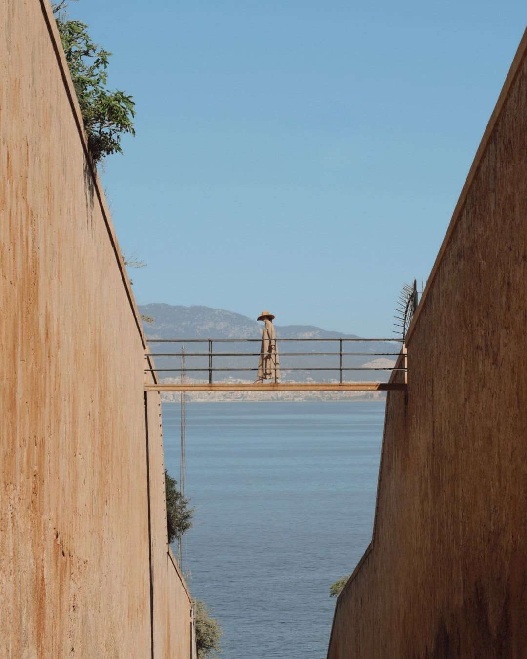 A woman on a bridge at Cap Rocat