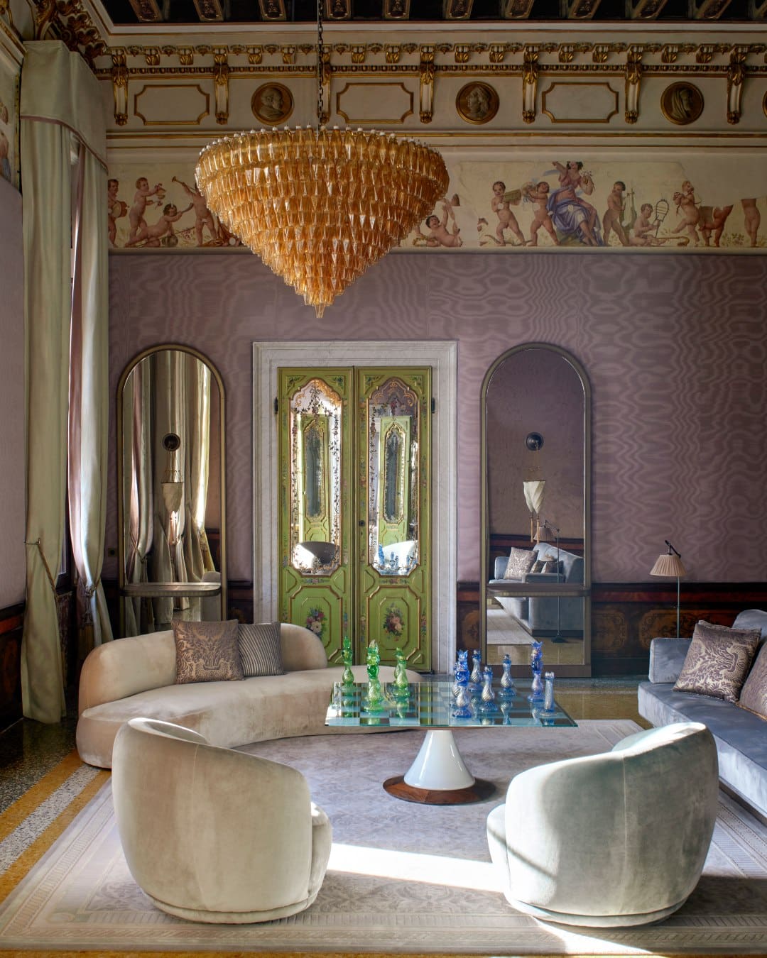 Cherubic friezes above moire silk walls in a signature suite at Orient Express Venezia, Italy